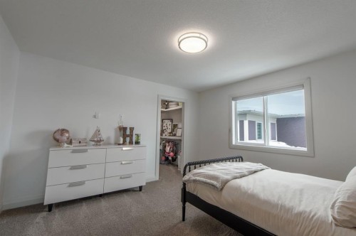 214 Aspenmere Green, Chestermere, AB - Indoor Photo Showing Bedroom