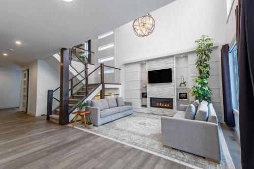 214 Aspenmere Green, Chestermere, AB - Indoor Photo Showing Living Room With Fireplace