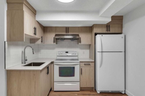 199 Cedardale Road Sw, Calgary, AB - Indoor Photo Showing Kitchen