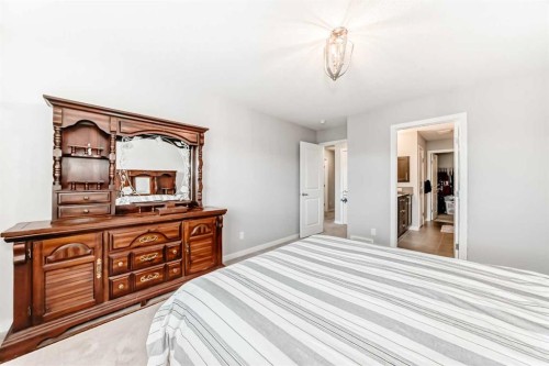 151 Sundown Way, Cochrane, AB - Indoor Photo Showing Bedroom
