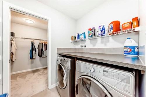 151 Sundown Way, Cochrane, AB - Indoor Photo Showing Laundry Room