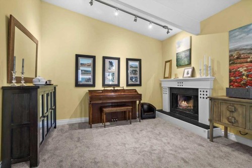 107 Woodford Crescent Sw, Calgary, AB - Indoor With Fireplace