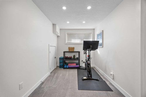 827 Canaveral Crescent Sw, Calgary, AB - Indoor Photo Showing Gym Room