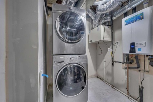 26 Corner Meadows Common Ne, Calgary, AB - Indoor Photo Showing Laundry Room
