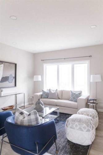 25 Sunrise Way, Cochrane, AB - Indoor Photo Showing Living Room