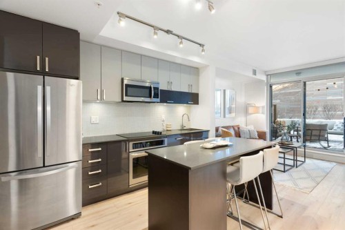 303-550 Riverfront Avenue Se, Calgary, AB - Indoor Photo Showing Kitchen With Stainless Steel Kitchen With Upgraded Kitchen