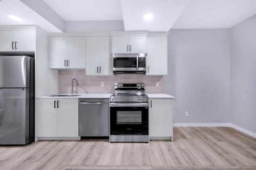 154 Silver Spruce Grove Sw, Calgary, AB - Indoor Photo Showing Kitchen With Stainless Steel Kitchen
