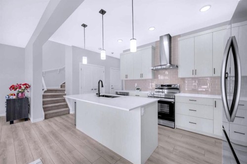 154 Silver Spruce Grove Sw, Calgary, AB - Indoor Photo Showing Kitchen With Upgraded Kitchen