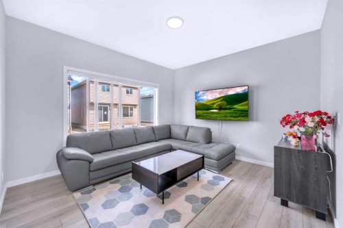 154 Silver Spruce Grove Sw, Calgary, AB - Indoor Photo Showing Living Room