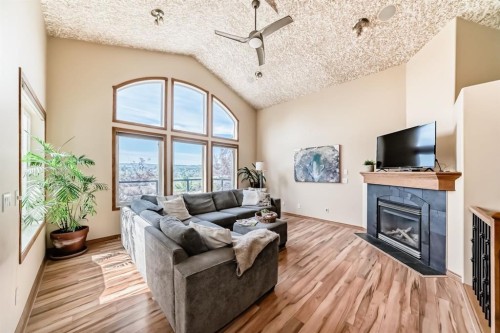 150 Hidden Creek Heights Nw, Calgary, AB - Indoor Photo Showing Living Room With Fireplace