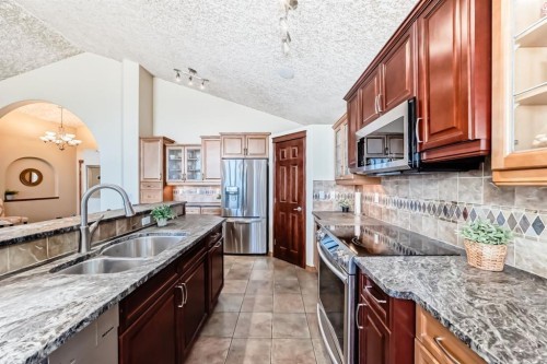 150 Hidden Creek Heights Nw, Calgary, AB - Indoor Photo Showing Kitchen With Double Sink With Upgraded Kitchen