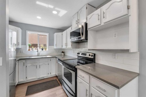 63 Erin Green Way Se, Calgary, AB - Indoor Photo Showing Kitchen With Upgraded Kitchen