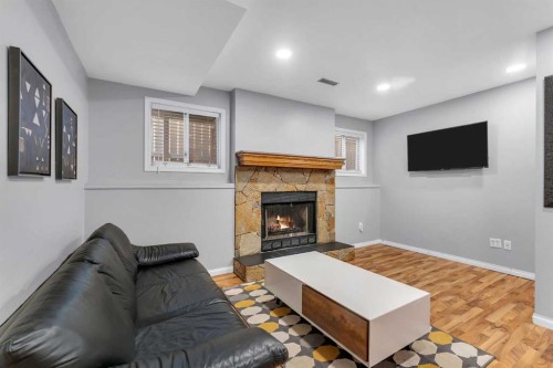 63 Erin Green Way Se, Calgary, AB - Indoor Photo Showing Living Room With Fireplace