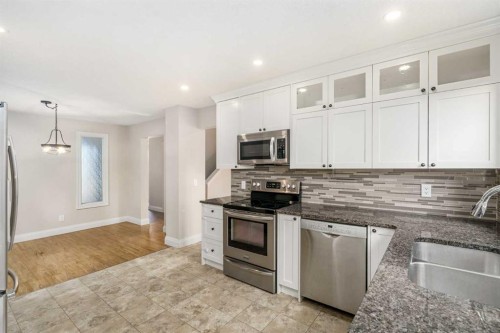 14-2815 Palliser Drive Sw, Calgary, AB - Indoor Photo Showing Kitchen With Double Sink With Upgraded Kitchen