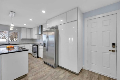 11 Selkirk Drive Sw, Calgary, AB - Indoor Photo Showing Kitchen With Stainless Steel Kitchen