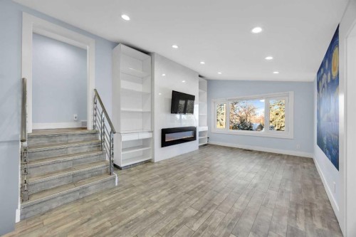 11 Selkirk Drive Sw, Calgary, AB - Indoor Photo Showing Other Room With Fireplace