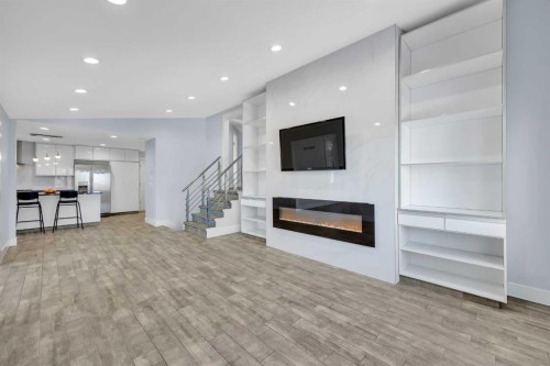 11 Selkirk Drive Sw, Calgary, AB - Indoor Photo Showing Living Room With Fireplace
