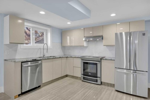 11 Selkirk Drive Sw, Calgary, AB - Indoor Photo Showing Kitchen With Stainless Steel Kitchen With Upgraded Kitchen