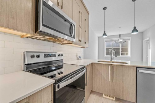 57 Corner Meadows Gate Ne, Calgary, AB - Indoor Photo Showing Kitchen With Upgraded Kitchen