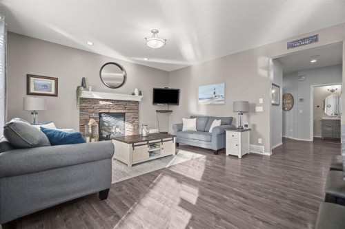 110 Brightonwoods Green Se, Calgary, AB - Indoor Photo Showing Living Room With Fireplace