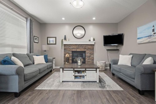 110 Brightonwoods Green Se, Calgary, AB - Indoor Photo Showing Living Room With Fireplace