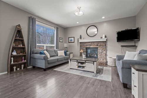 110 Brightonwoods Green Se, Calgary, AB - Indoor Photo Showing Living Room With Fireplace
