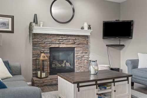 110 Brightonwoods Green Se, Calgary, AB - Indoor Photo Showing Living Room With Fireplace