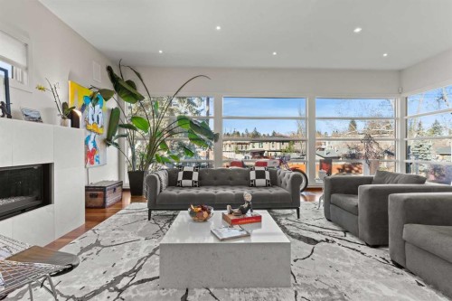 4712 Elbow Drive Sw, Calgary, AB - Indoor Photo Showing Living Room With Fireplace