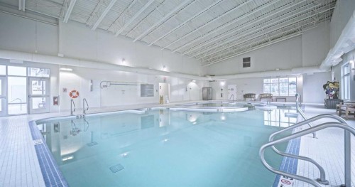 642 Cottageclub Bend, Rural Rocky View County, AB - Indoor Photo Showing Other Room With In Ground Pool