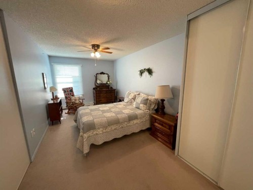 405-1881 17 Street, Didsbury, AB - Indoor Photo Showing Bedroom