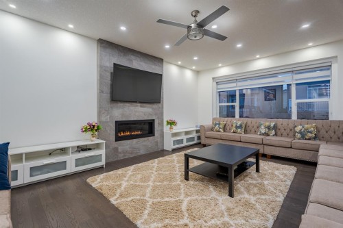 248 Sandpiper Boulevard, Chestermere, AB - Indoor Photo Showing Living Room With Fireplace