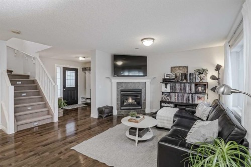 230 Sagewood Grove Sw, Airdrie, AB - Indoor Photo Showing Living Room With Fireplace