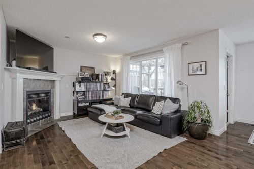 230 Sagewood Grove Sw, Airdrie, AB - Indoor Photo Showing Living Room With Fireplace