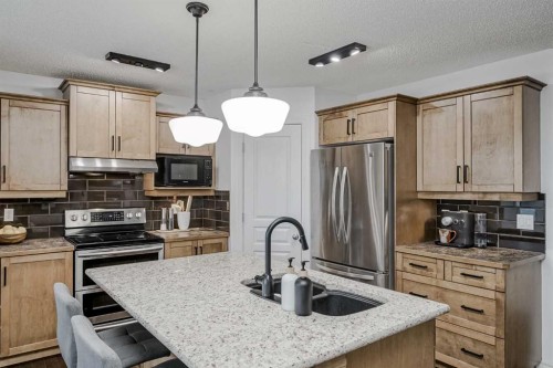 230 Sagewood Grove Sw, Airdrie, AB - Indoor Photo Showing Kitchen With Double Sink