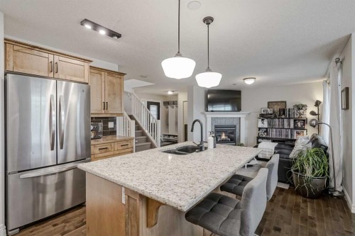 230 Sagewood Grove Sw, Airdrie, AB - Indoor Photo Showing Kitchen With Double Sink With Upgraded Kitchen