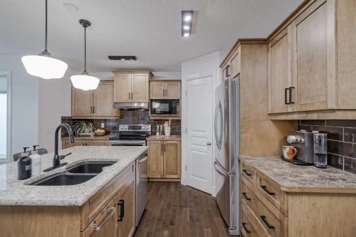 230 Sagewood Grove Sw, Airdrie, AB - Indoor Photo Showing Kitchen With Double Sink