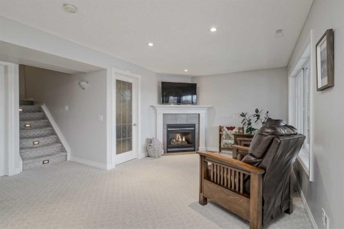 230 Sagewood Grove Sw, Airdrie, AB - Indoor Photo Showing Other Room With Fireplace