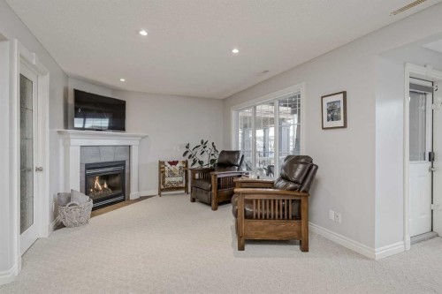 230 Sagewood Grove Sw, Airdrie, AB - Indoor Photo Showing Living Room With Fireplace