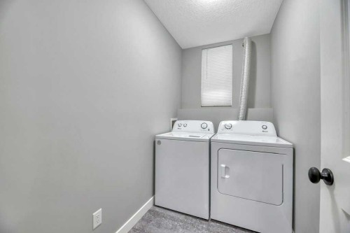 12-606 Lakeside Boulevard, Strathmore, AB - Indoor Photo Showing Laundry Room