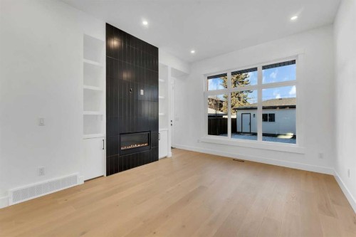 452 22 Avenue Ne, Calgary, AB - Indoor Photo Showing Living Room With Fireplace