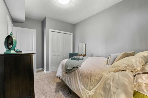 100 Hillcrest Boulevard, Strathmore, AB - Indoor Photo Showing Bedroom