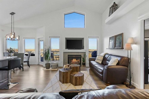 100 Hillcrest Boulevard, Strathmore, AB - Indoor Photo Showing Living Room With Fireplace
