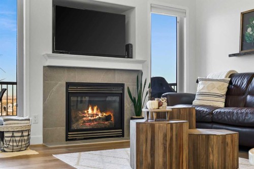 100 Hillcrest Boulevard, Strathmore, AB - Indoor Photo Showing Living Room With Fireplace