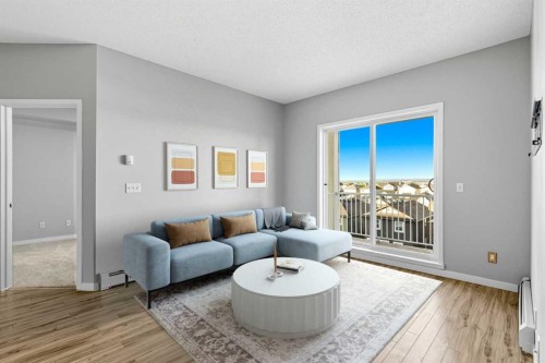 1414-1140 Taradale Drive Ne, Calgary, AB - Indoor Photo Showing Living Room