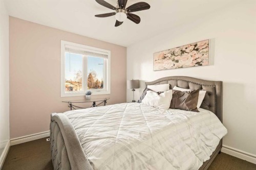 25 Mckinley Bay Se, Calgary, AB - Indoor Photo Showing Bedroom