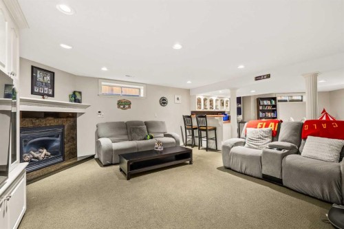 25 Mckinley Bay Se, Calgary, AB - Indoor With Fireplace