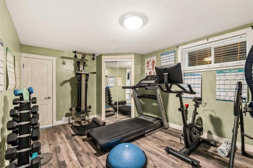 25 Mckinley Bay Se, Calgary, AB - Indoor Photo Showing Gym Room