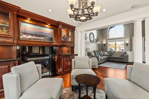 25 Mckinley Bay Se, Calgary, AB - Indoor Photo Showing Living Room With Fireplace