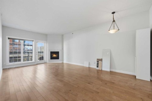 402-820 15 Avenue Sw, Calgary, AB - Indoor Photo Showing Living Room With Fireplace