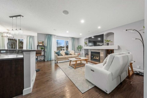42 Tuscany Meadows Bay Nw, Calgary, AB - Indoor Photo Showing Living Room With Fireplace